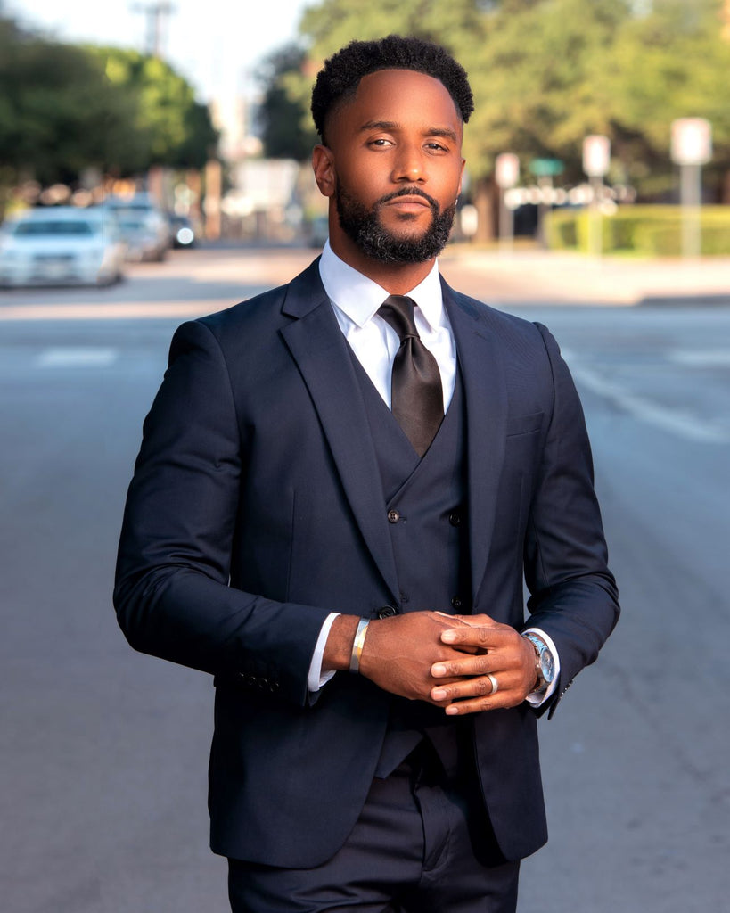 Three-piece navy blue suit with vest, jacket, and pants