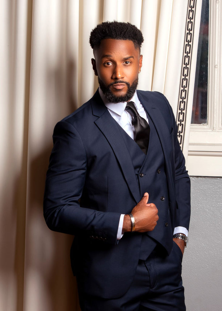 Slim-fit navy blue suit with vest and tapered pants
